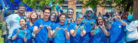 University of Waterloo Science students in blue t-shirts pose for the camera