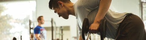 man lifting weights