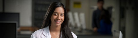 student in lab coat