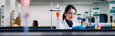 A student in the Chemistry program performing a titration in a lab at the University of Waterloo