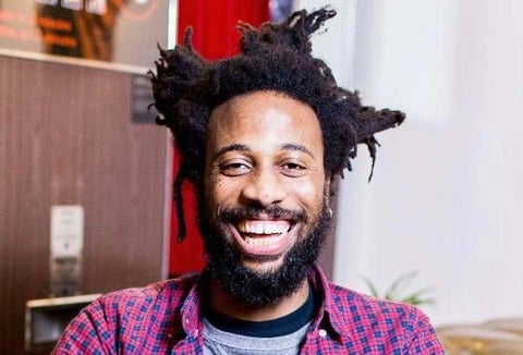 Chris smiles in an office setting