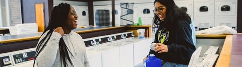 Students doing laundry in residence.