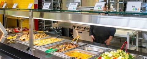 A hot food bar at a residence dining hall.