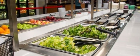 A close up of a salad bar.
