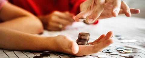 Coins in person's hand