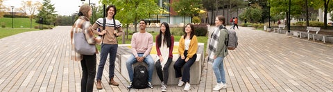 students gathered for a picture outside of DP library