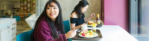 student eating campus food