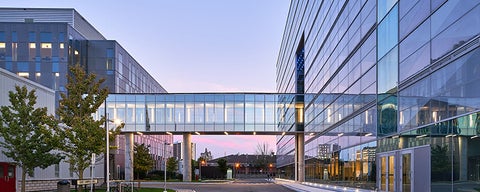 Engineering building sky bridge and sunset.