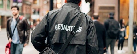 Person wearing a jacket that says "Geomatics".