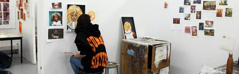 someone painting in an art studio