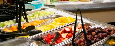 Close up of fruits at a self-serve station.