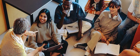 A group of people gathered together having a discussion