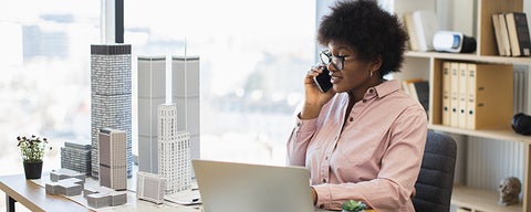 Person in office on the phone