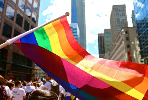 Rainbow flag waving during a pride march