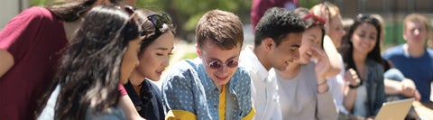 Group of students sitting together outside