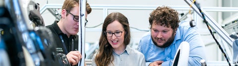 Three students working on a project