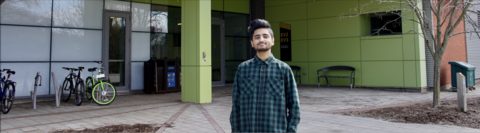 Hafeez, an urban planning student standing outside of EV3