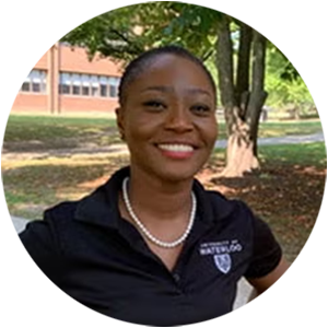 A photograph of Akua with a big smile