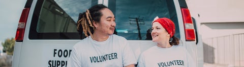 Two student volunteers looking at each other