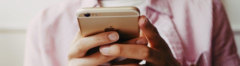 Close up of person holding a smartphone