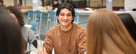 student at table