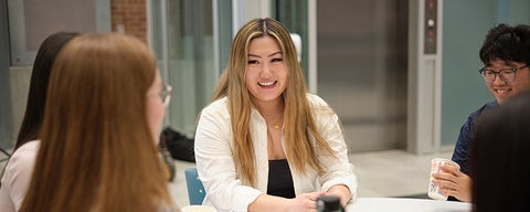 student at table