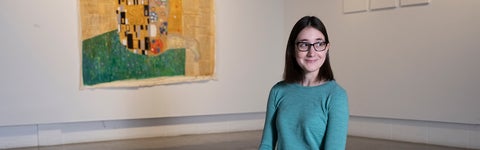 A student sitting in an art gallery