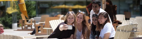 Students taking a selfie outside