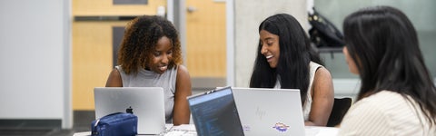 Management engineering students working through a project