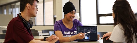 students looking at statistics on a computer