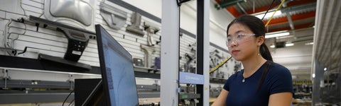 Mechanical engineering student conducting materials testing