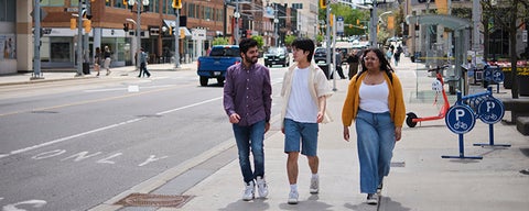 Three students walking in Uptown Waterloo.