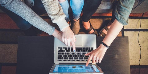 Hands on a keyboard of a laptop