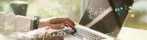 Person using a laptop with physics equations flying around.