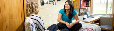 Students talking in a dorm