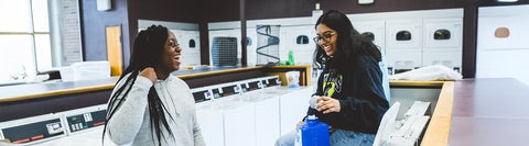 Students sitting in the laundry room