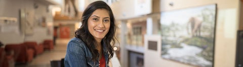 girl smiling at the camera in a lounge