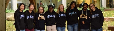 Group of Science students standing together in Waterloo hoodies