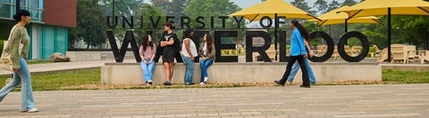 A group of students in front of the Waterloo sign