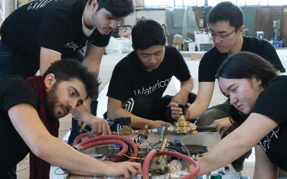 Five students working on a design team project.