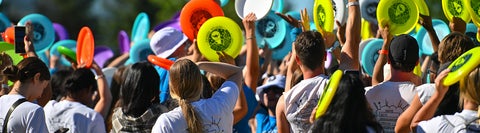 Health students enjoying life and playing frisbee outside