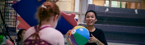Therapeutic Recreation student in pool with child