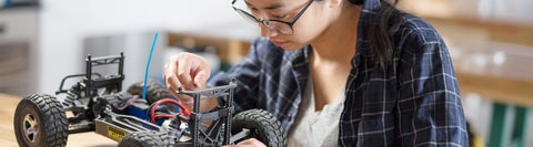 student building a miniature car