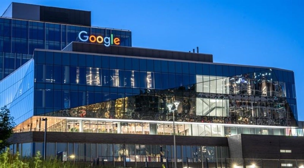 The Google building in Waterloo against a dark blue sky.