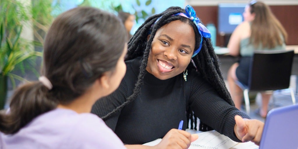 Two University of Waterloo students working at a desk