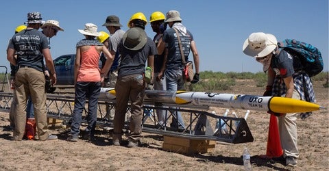 Students stand around the world record breaking rocket
