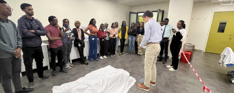 Sebastion demonstrating a procedure to a group of people