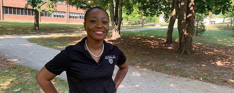 Akua standing and smiling