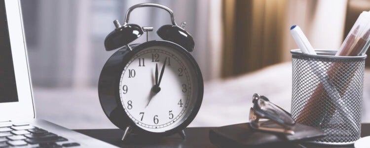 Alarm clock on a desk.