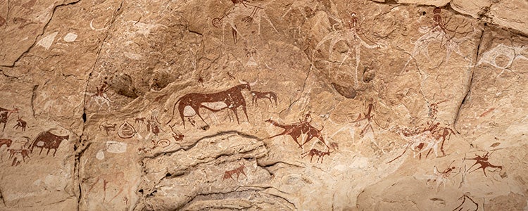 Cave art of animals on a stone wall